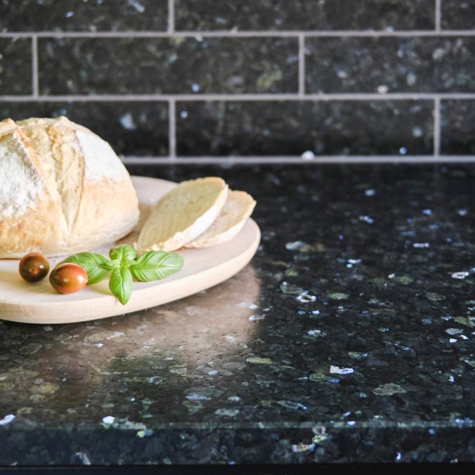LUNDHS® REAL STONE – Emerald® tile backsplash and kitchen countertop  –  photo courtesy of Morten Rakke for LUNDHS®